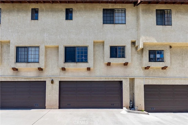 854 N Harbor Blvd, La Habra, CA 90631 - view of front of home with stucco siding, a garage, and driveway