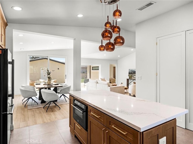 11410 Reseda Blvd, Porter Ranch, CA 91326 - kitchen with black appliances, open floor plan, a kitchen island, light stone countertops, and recessed lighting