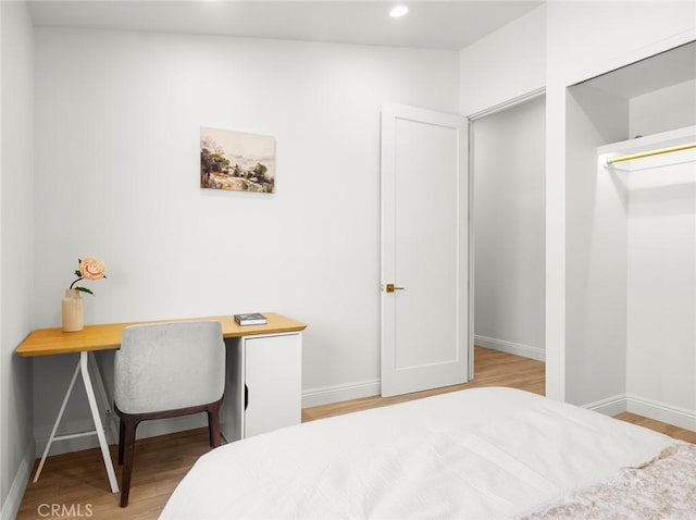 11410 Reseda Blvd, Porter Ranch, CA 91326 - bedroom featuring light wood finished floors, recessed lighting, and an office area