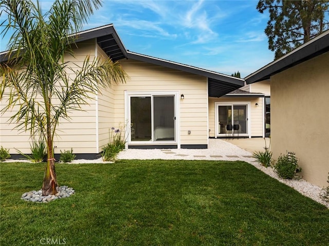 11410 Reseda Blvd, Porter Ranch, CA 91326 - rear view of property with a lawn and a patio