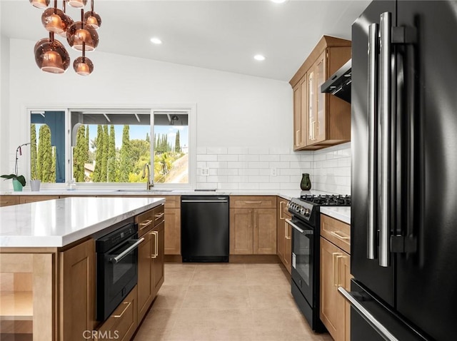 11410 Reseda Blvd, Porter Ranch, CA 91326 - kitchen with black appliances, tasteful backsplash, light countertops, recessed lighting, and light tile patterned flooring