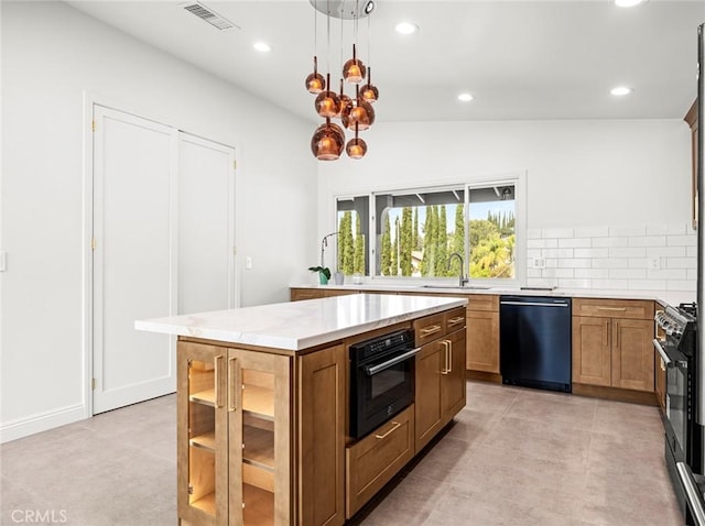 11410 Reseda Blvd, Porter Ranch, CA 91326 - kitchen with black appliances, recessed lighting, a kitchen island, backsplash, and brown cabinets