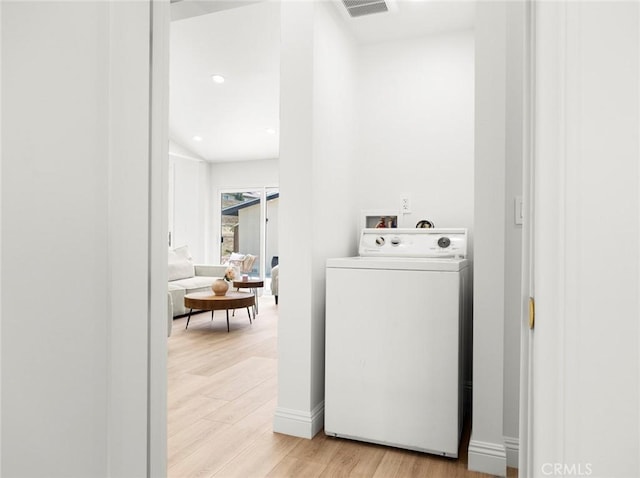 11410 Reseda Blvd, Porter Ranch, CA 91326 - washroom with washer / clothes dryer and light wood-style flooring