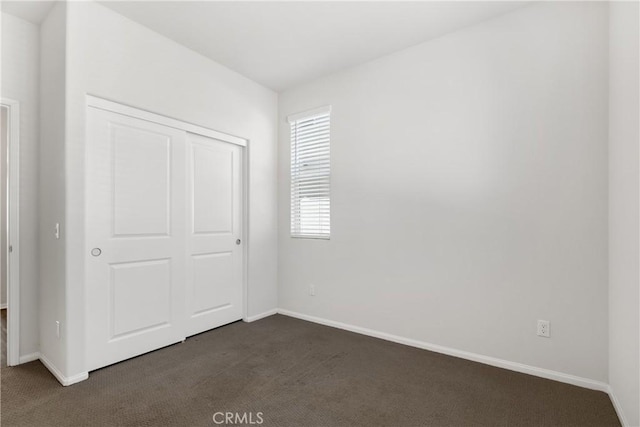 36390 W Flare, Winchester, CA 92569 - unfurnished bedroom with dark colored carpet and a closet