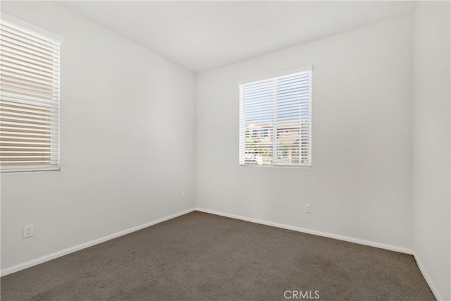 36390 W Flare, Winchester, CA 92569 - empty room featuring dark carpet and baseboards