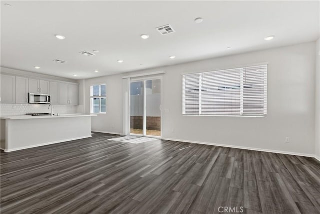 36390 W Flare, Winchester, CA 92569 - unfurnished living room featuring dark wood finished floors and recessed lighting
