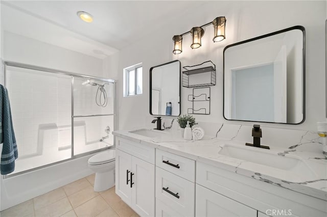 14840 Dove Tree Ct, Tustin, CA 92780 - full bathroom with double vanity, tile patterned floors, and combined bath / shower with glass door