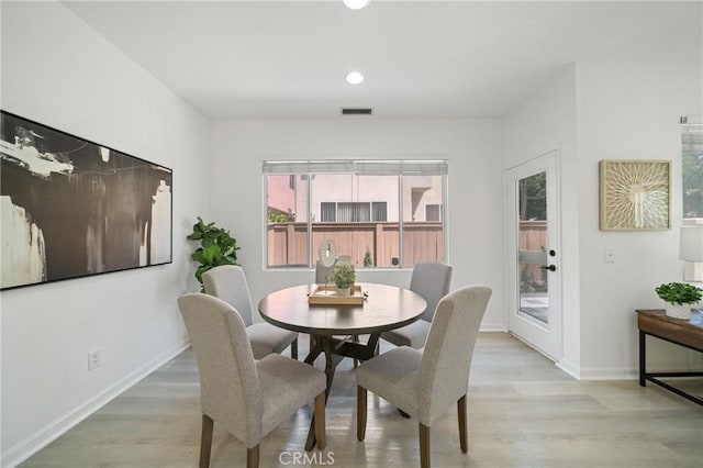 14840 Dove Tree Ct, Tustin, CA 92780 - dining room featuring light wood finished floors and recessed lighting