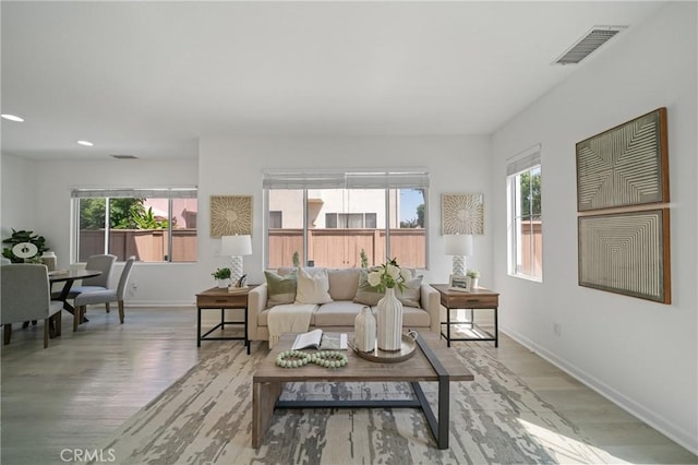 14840 Dove Tree Ct, Tustin, CA 92780 - living area with wood finished floors, plenty of natural light, and recessed lighting