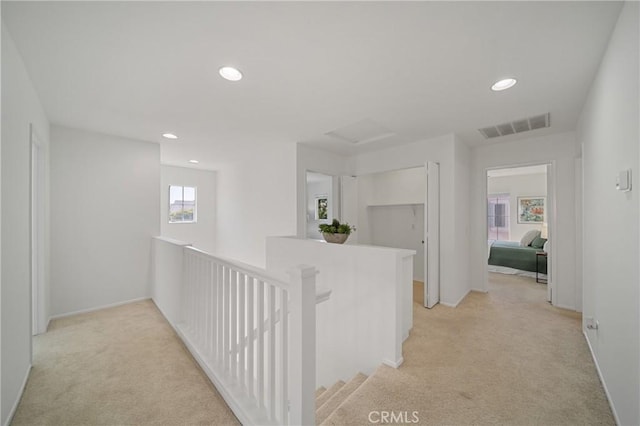 14840 Dove Tree Ct, Tustin, CA 92780 - hallway with an upstairs landing, light carpet, recessed lighting, and attic access