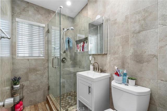 10422 Patricia Dr, Garden Grove, CA 92840 - bathroom featuring tile walls, vanity, and a stall shower