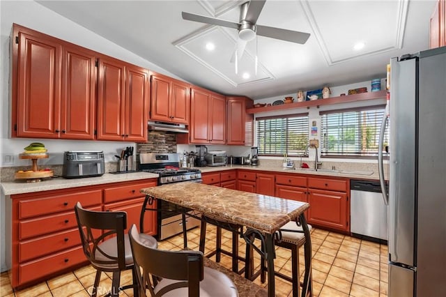 10422 Patricia Dr, Garden Grove, CA 92840 - kitchen with stainless steel appliances, under cabinet range hood, a ceiling fan, light countertops, and lofted ceiling