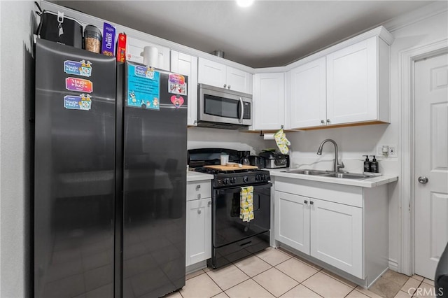 10422 Patricia Dr, Garden Grove, CA 92840 - kitchen featuring black appliances, light tile patterned flooring, light countertops, and white cabinets