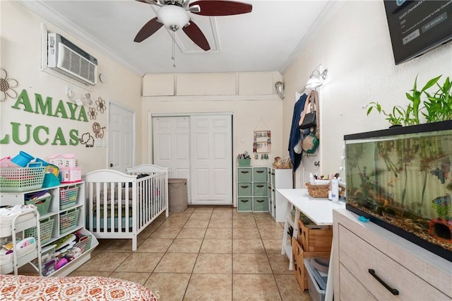10422 Patricia Dr, Garden Grove, CA 92840 - bedroom with ornamental molding, light tile patterned floors, a wall unit AC, a ceiling fan, and a closet
