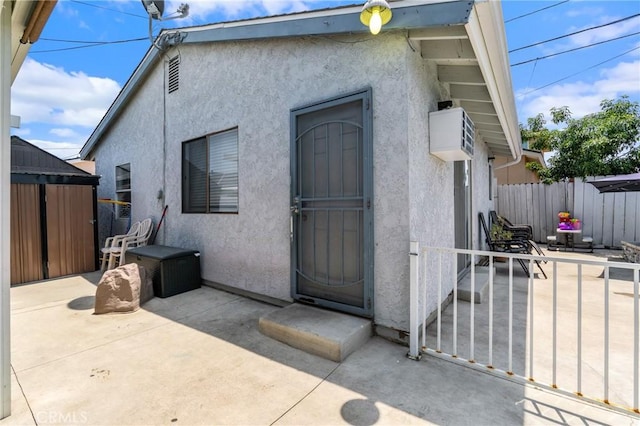 10422 Patricia Dr, Garden Grove, CA 92840 - view of exterior entry with a patio and stucco siding