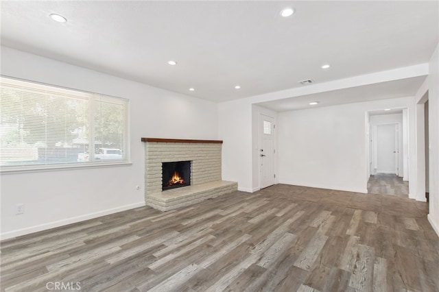 4215 Sherman Dr, Riverside, CA 92503 - unfurnished living room featuring a fireplace, wood finished floors, and recessed lighting