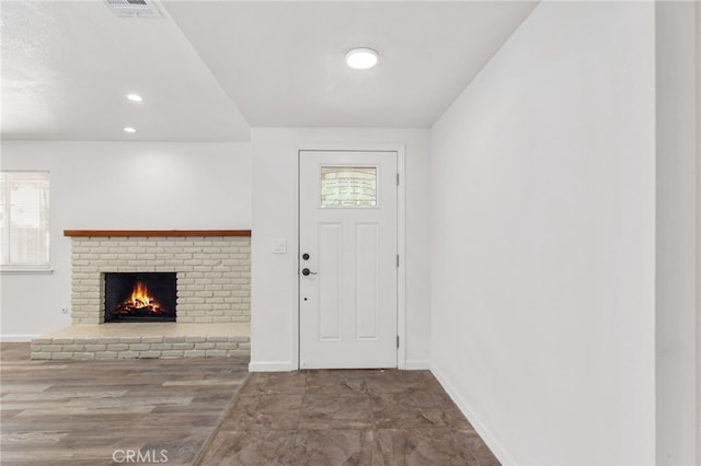 4215 Sherman Dr, Riverside, CA 92503 - entryway featuring a brick fireplace and recessed lighting