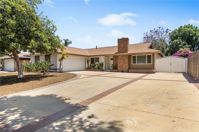 4215 Sherman Dr, Riverside, CA 92503 - ranch-style home featuring driveway, a gate, a garage, a chimney, and stucco siding