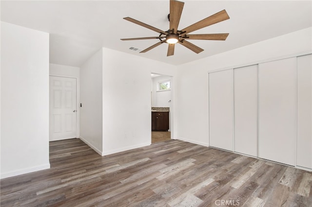 4215 Sherman Dr, Riverside, CA 92503 - unfurnished bedroom featuring wood finished floors, a closet, ceiling fan, and ensuite bath