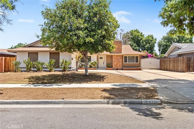 4215 Sherman Dr, Riverside, CA 92503 - view of front of home with a gate and driveway