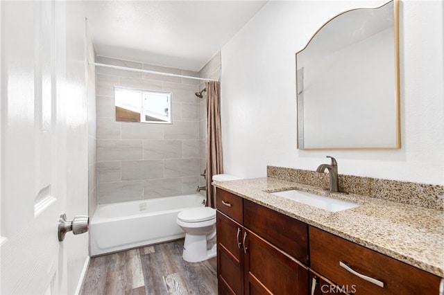 4215 Sherman Dr, Riverside, CA 92503 - full bathroom featuring vanity, wood finished floors, and shower / tub combo