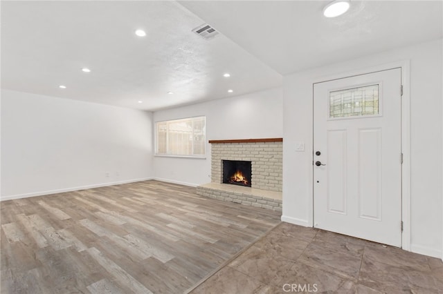 4215 Sherman Dr, Riverside, CA 92503 - unfurnished living room with recessed lighting, a fireplace, and wood finished floors