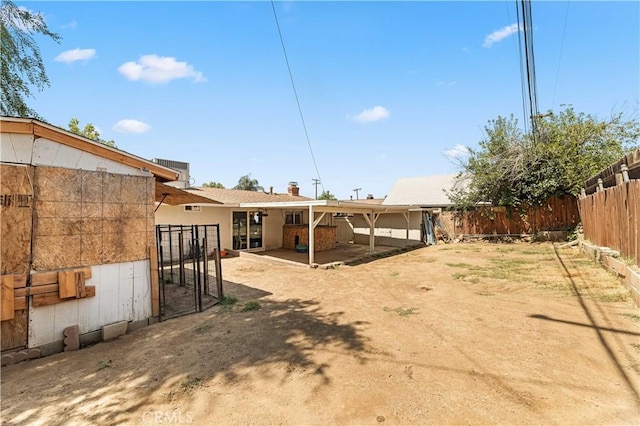 26920 14th St, Highland, CA 92346 - rear view of house featuring a fenced backyard and a patio area