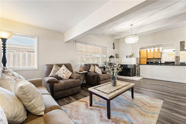26920 14th St, Highland, CA 92346 - living area with dark wood finished floors and beam ceiling