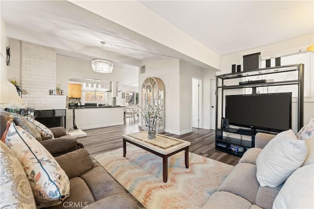 26920 14th St, Highland, CA 92346 - living area with wood finished floors and a chandelier