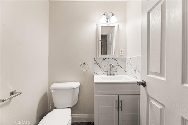 26920 14th St, Highland, CA 92346 - half bathroom featuring vanity and tasteful backsplash