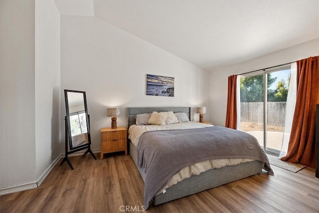 1288 Capitola St, Grover Beach, CA 93433 - bedroom with access to outside, wood finished floors, and high vaulted ceiling