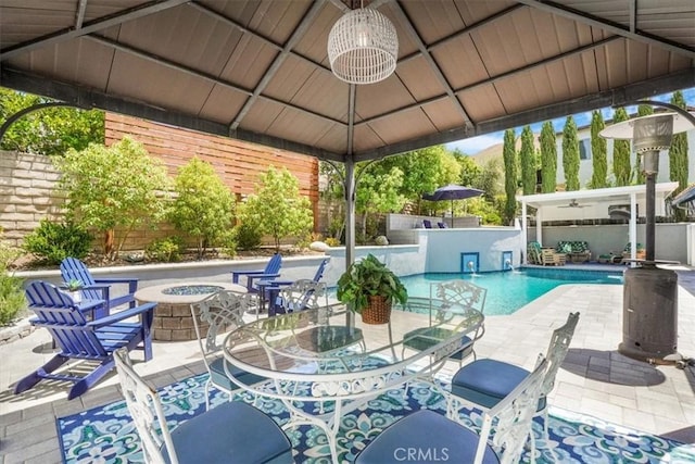 28639 Quaint St, Agoura Hills, CA 91301 - view of swimming pool featuring a gazebo, an outdoor fire pit, ceiling fan, and a patio area