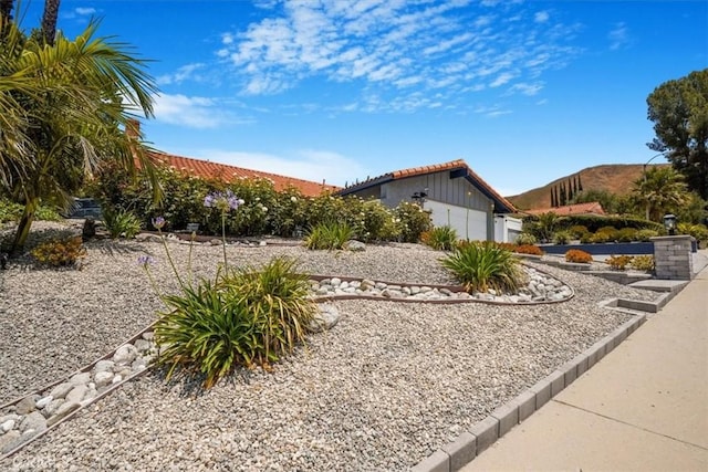 28639 Quaint St, Agoura Hills, CA 91301 - view of yard with an attached garage and a mountain view