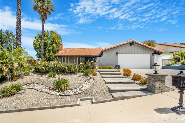 28639 Quaint St, Agoura Hills, CA 91301 - single story home with a tiled roof, a garage, a chimney, driveway, and stucco siding