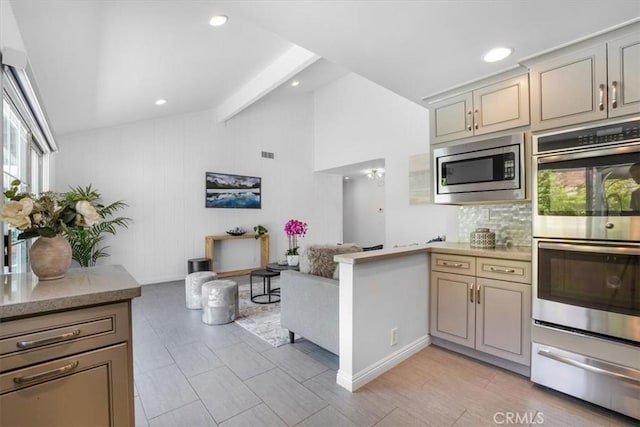 28639 Quaint St, Agoura Hills, CA 91301 - kitchen with stainless steel appliances, a warming drawer, tasteful backsplash, open floor plan, and light stone countertops