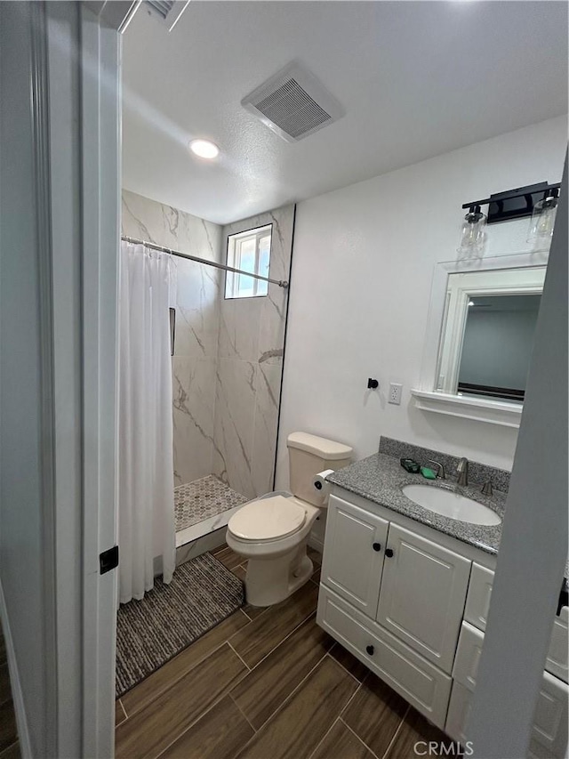 35862 Rabbit Spring Rd, Lucerne Valley, CA 92356 - bathroom with a marble finish shower, vanity, and wood finish floors