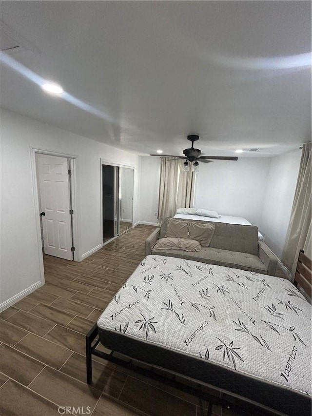 35862 Rabbit Spring Rd, Lucerne Valley, CA 92356 - bedroom with wood tiled floors, a closet, and a ceiling fan