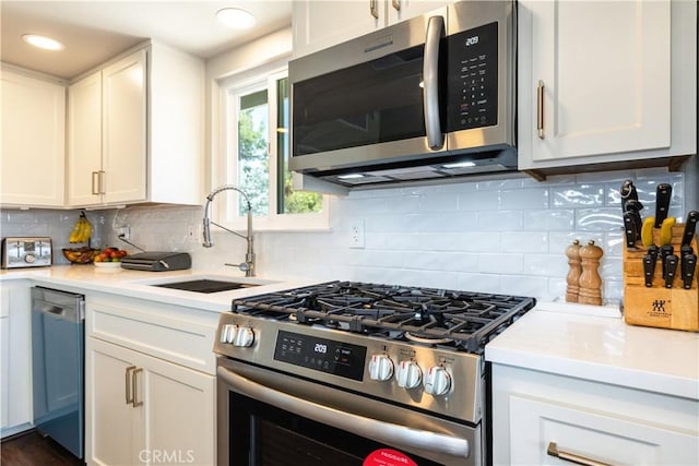 4725 Arena Ave, Atascadero, CA 93422 - kitchen with appliances with stainless steel finishes, light countertops, white cabinets, tasteful backsplash, and recessed lighting
