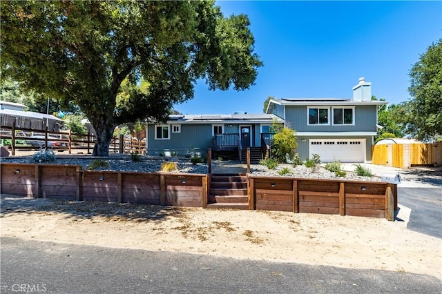 4725 Arena Ave, Atascadero, CA 93422 - split level home with solar panels, a chimney, and stairway