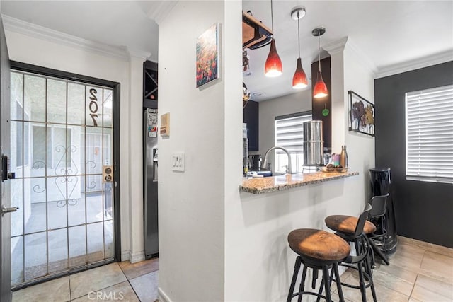1566 Pine Ave Unit 207A, Long Beach, CA 90813 - entryway with tile patterned floors, ornamental molding, and plenty of natural light