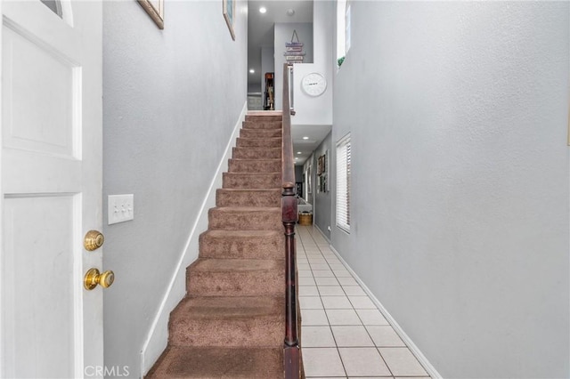 14343 Marilla Ave, Norwalk, CA 90650 - stairway featuring a towering ceiling, tile patterned flooring, and plenty of natural light