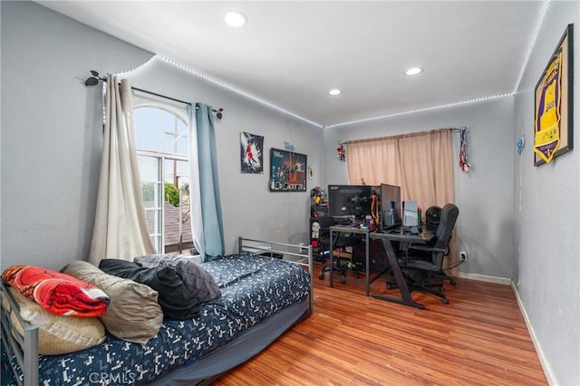 14343 Marilla Ave, Norwalk, CA 90650 - bedroom with wood finished floors, recessed lighting, and a desk
