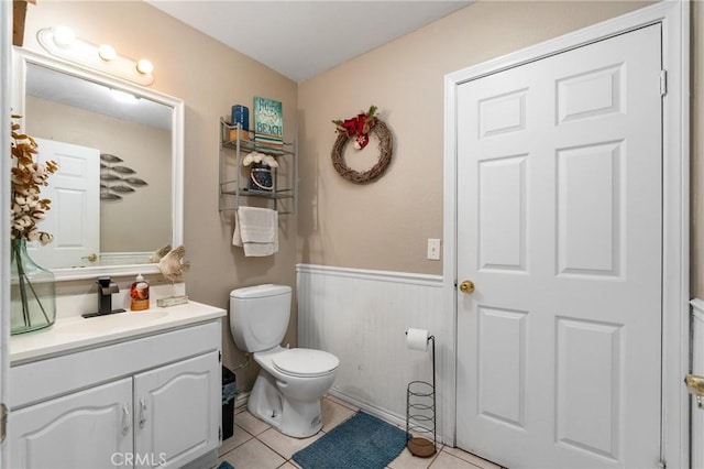 14343 Marilla Ave, Norwalk, CA 90650 - half bathroom with a wainscoted wall, vanity, and tile patterned flooring