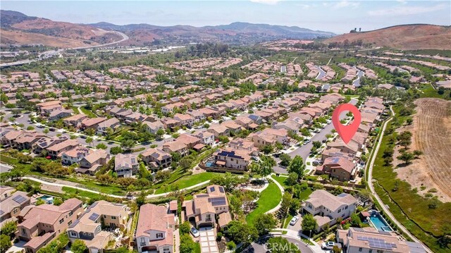 27 Cache St, Rancho Mission Viejo, CA 92694 - aerial view of property's location with a mountainous background and nearby suburban area