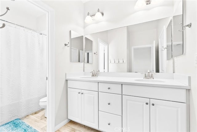 27 Cache St, Rancho Mission Viejo, CA 92694 - bathroom with double vanity and wood finished floors