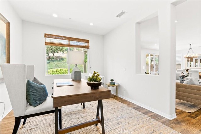 27 Cache St, Rancho Mission Viejo, CA 92694 - office area with wood finished floors, healthy amount of natural light, recessed lighting, and a chandelier