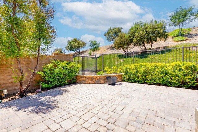 27 Cache St, Rancho Mission Viejo, CA 92694 - fenced backyard featuring a patio area