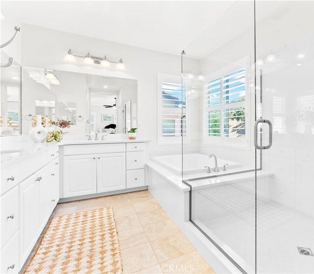 27 Cache St, Rancho Mission Viejo, CA 92694 - full bath featuring a garden tub, vanity, a stall shower, tile patterned flooring, and a ceiling fan