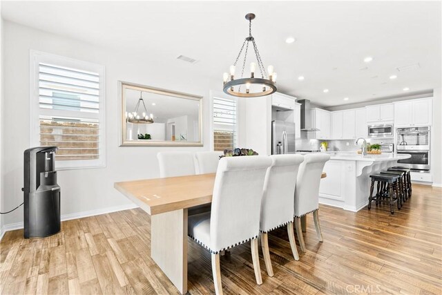 27 Cache St, Rancho Mission Viejo, CA 92694 - dining area with a chandelier, light wood-type flooring, and recessed lighting