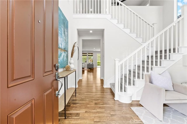 27 Cache St, Rancho Mission Viejo, CA 92694 - foyer entrance featuring stairway, light wood finished floors, a towering ceiling, and recessed lighting